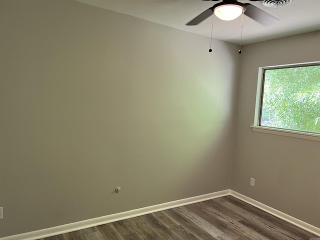 20 Glendale Dr, Little Rock, AR 72209 - spare room featuring dark wood-type flooring, a ceiling fan, and baseboards