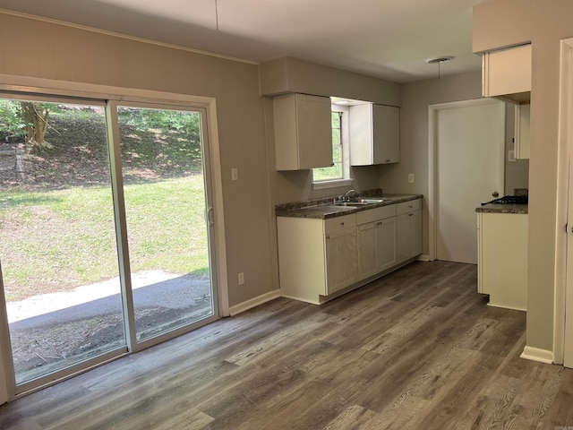 20 Glendale Dr, Little Rock, AR 72209 - kitchen with a sink, white cabinetry, dark wood-style flooring, and baseboards