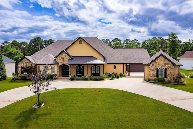 20 Accadia Ct, Little Rock, AR 72223 - view of front of house with curved driveway, stone siding, a front lawn, and roof with shingles