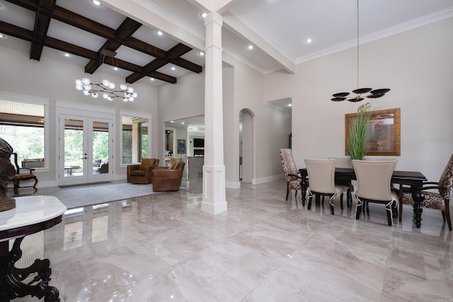 20 Accadia Ct, Little Rock, AR 72223 - dining space featuring ornate columns, a towering ceiling, light marble finish floors, baseboards, and beam ceiling