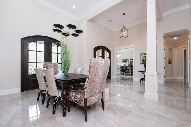 20 Accadia Ct, Little Rock, AR 72223 - dining area with light marble finish floors, arched walkways, crown molding, a chandelier, and baseboards