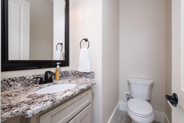 20 Accadia Ct, Little Rock, AR 72223 - half bath featuring toilet, vanity, and baseboards