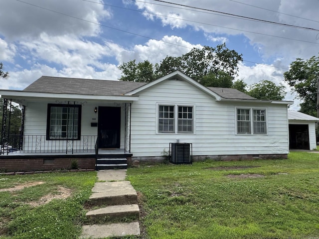 500 W 17th St, North Little Rock, AR 72114 - view of front of house featuring covered porch, crawl space, central air condition unit, and a front lawn