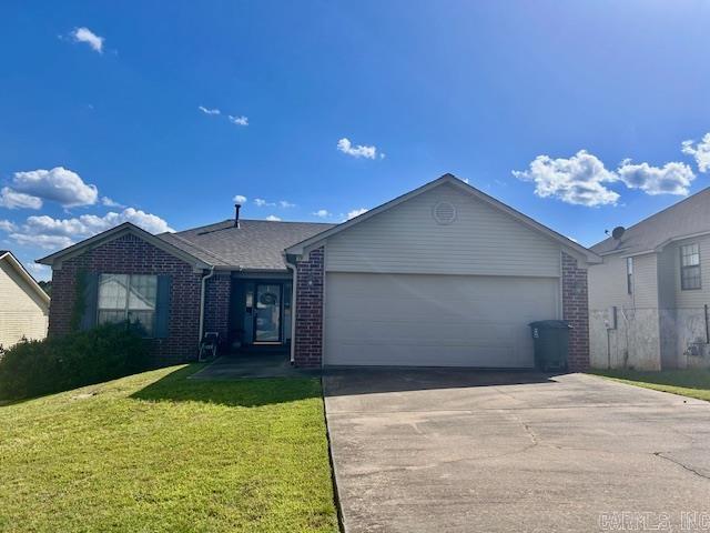 19 Britts Ln, Little Rock, AR 72209 - ranch-style home featuring brick siding, concrete driveway, an attached garage, and a front lawn