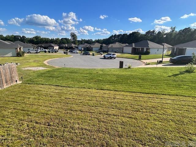 19 Britts Ln, Little Rock, AR 72209 - view of grassy yard featuring a residential view