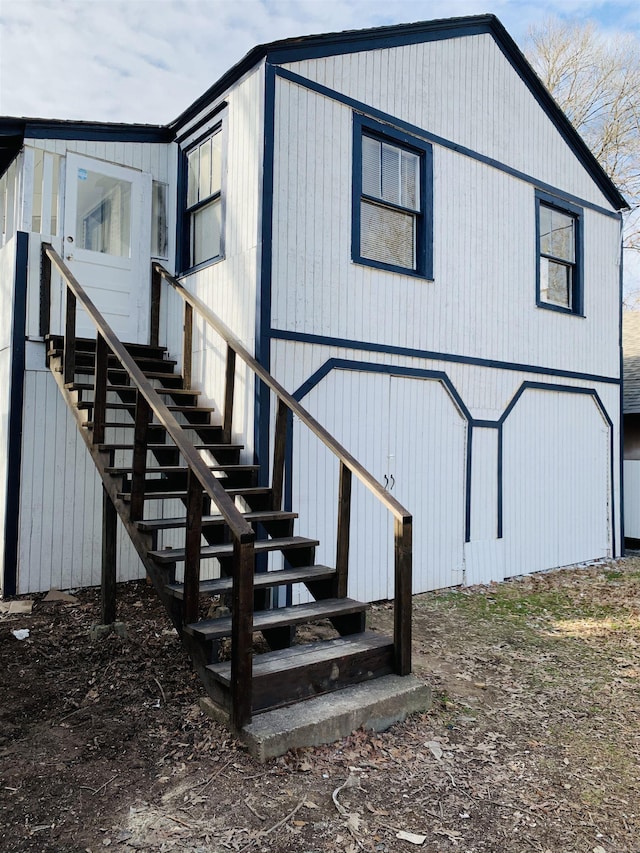 view of home's exterior featuring stairs