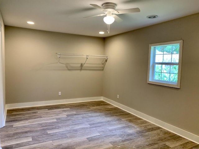 spare room featuring ceiling fan, baseboards, wood finished floors, and recessed lighting