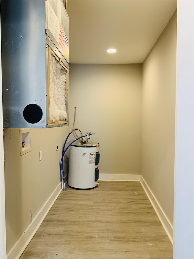 laundry area featuring washer hookup, electric water heater, baseboards, light wood-type flooring, and recessed lighting