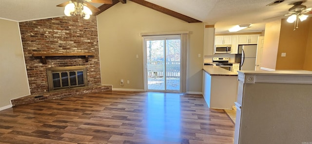 203 Creekwood Dr, Jacksonville, AR 72076 - kitchen featuring ceiling fan, stainless steel appliances, wood finished floors, and a textured ceiling
