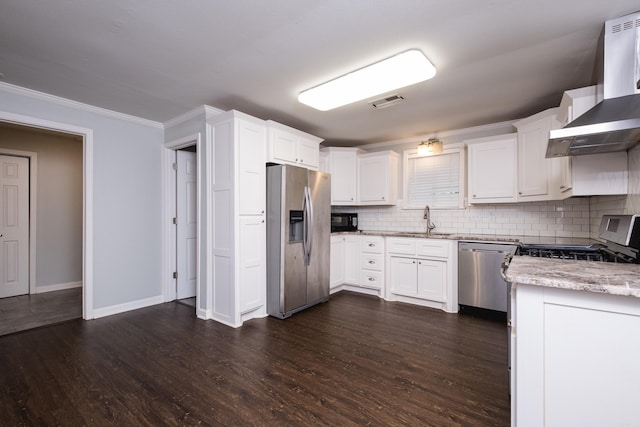 708 N Taylor St, Little Rock, AR 72205 - kitchen featuring stainless steel appliances, wall chimney exhaust hood, a sink, ornamental molding, and decorative backsplash