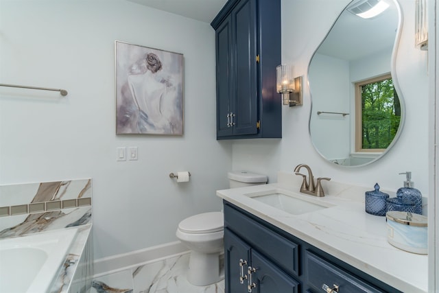 full bath with marble look tiles, baseboards, vanity, a bathtub, and toilet