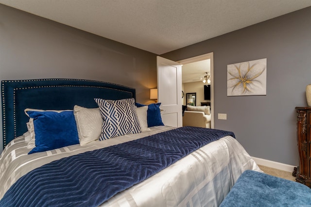 carpeted bedroom with baseboards