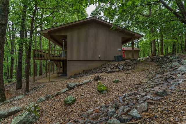 view of side of property with a wooden deck