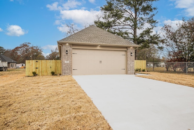412 N 3rd St, Cabot, AR 72023 - view of property exterior featuring brick siding, a shingled roof, and driveway