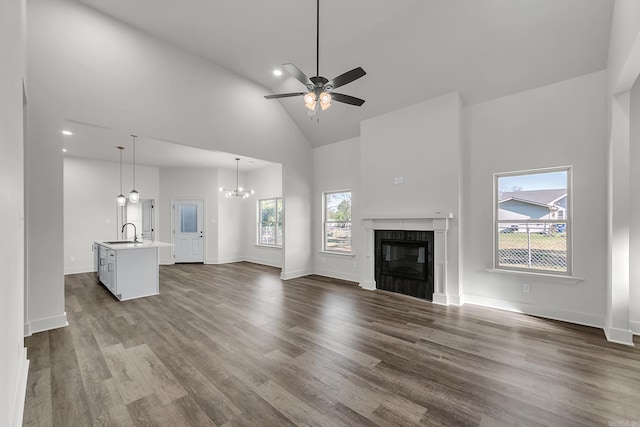 412 N 3rd St, Cabot, AR 72023 - unfurnished living room featuring a sink, high vaulted ceiling, dark wood-type flooring, ceiling fan, and a tiled fireplace