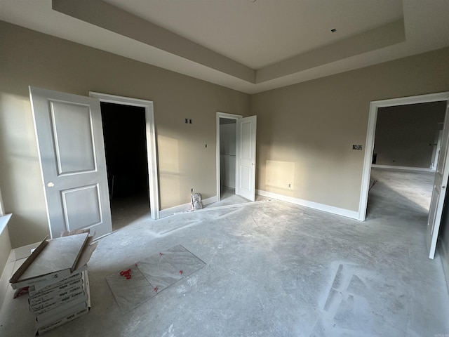 412 N 3rd St, Cabot, AR 72023 - unfurnished bedroom featuring a raised ceiling and baseboards