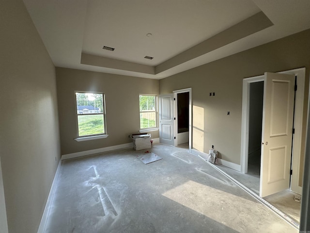 412 N 3rd St, Cabot, AR 72023 - unfurnished bedroom with a tray ceiling and baseboards