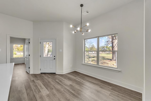 412 N 3rd St, Cabot, AR 72023 - entrance foyer with a chandelier, wood finished floors, and baseboards