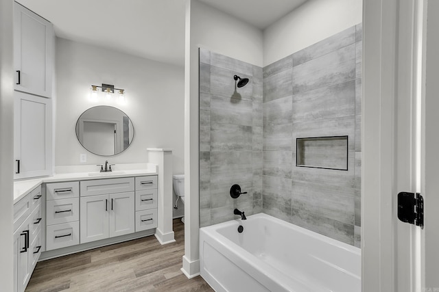 412 N 3rd St, Cabot, AR 72023 - full bath featuring vanity, wood finished floors, bathing tub / shower combination, toilet, and baseboards