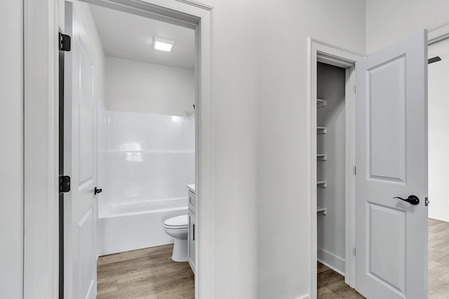 412 N 3rd St, Cabot, AR 72023 - full bathroom with wood finished floors, toilet, and bathing tub / shower combination