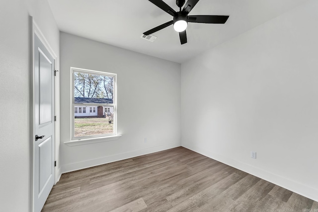 412 N 3rd St, Cabot, AR 72023 - unfurnished bedroom with wood finished floors, baseboards, and ceiling fan