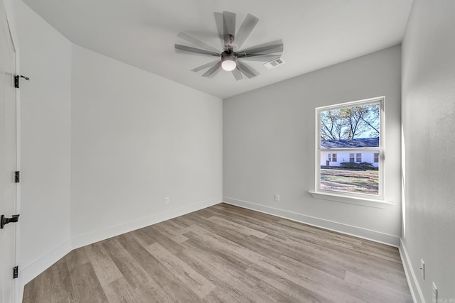 412 N 3rd St, Cabot, AR 72023 - unfurnished room with wood finished floors, a ceiling fan, and baseboards