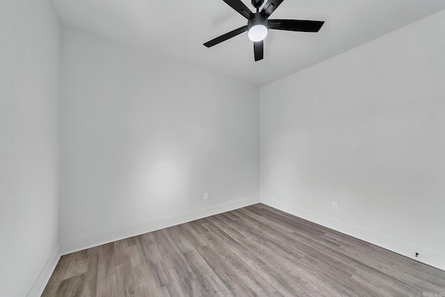 412 N 3rd St, Cabot, AR 72023 - spare room with wood finished floors, a ceiling fan, and baseboards