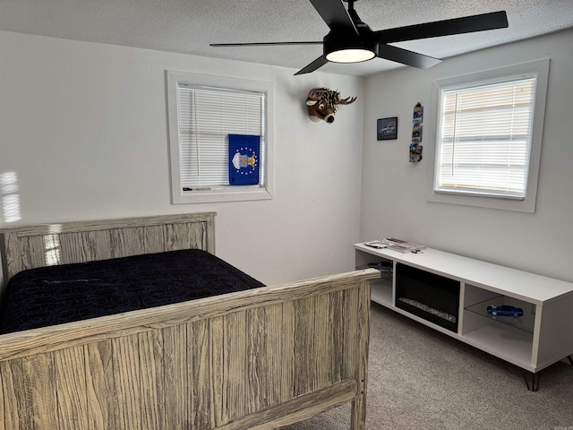 810 N Pear St, Searcy, AR 72143 - bedroom featuring light carpet, a textured ceiling, and a ceiling fan