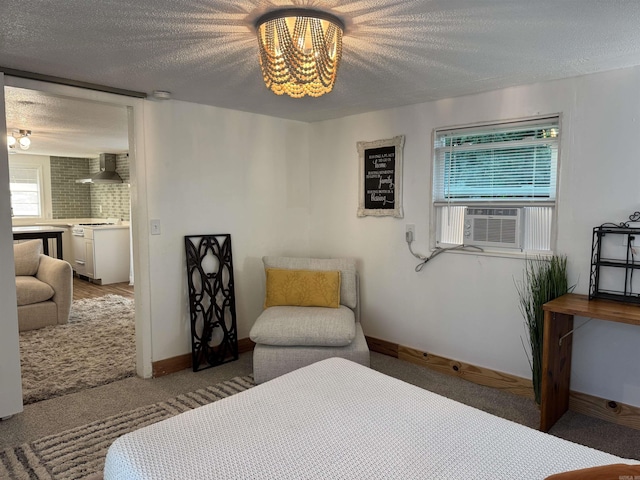 810 N Pear St, Searcy, AR 72143 - bedroom with a textured ceiling, a chandelier, cooling unit, baseboards, and light carpet