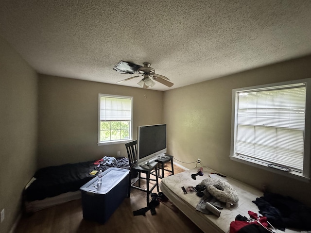 1416 Dogwood Trl, Malvern, AR 72104 - bedroom with wood finished floors, a textured ceiling, and ceiling fan