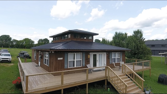 4579 Bayou Access Rd, Mammoth Spring, AR 72554 - back of house with a deck, metal roof, a lawn, and stairs
