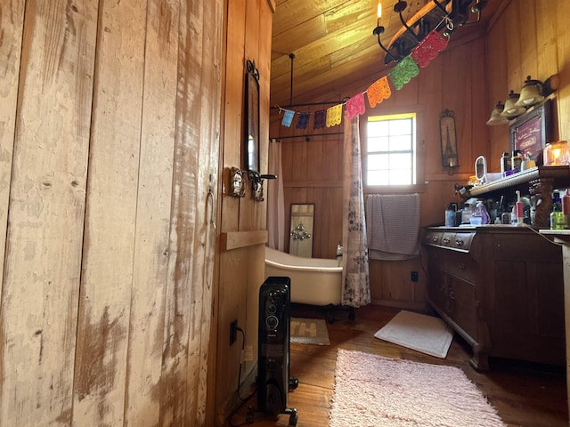 4579 Bayou Access Rd, Mammoth Spring, AR 72554 - bathroom with wood finished floors, wooden walls, a bath, and wood ceiling
