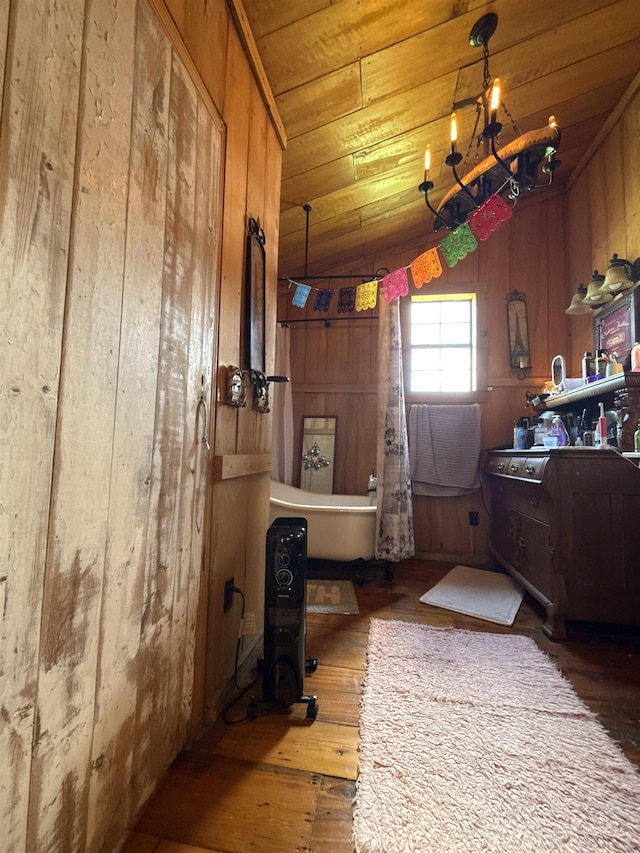 4579 Bayou Access Rd, Mammoth Spring, AR 72554 - interior space with wooden walls, hardwood / wood-style flooring, a freestanding tub, and wooden ceiling