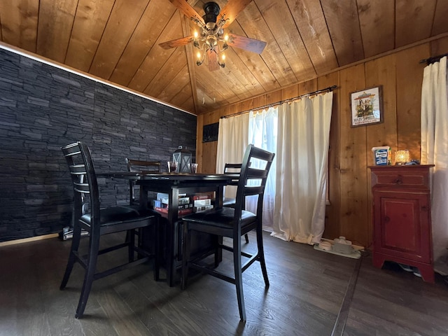 4579 Bayou Access Rd, Mammoth Spring, AR 72554 - dining room featuring wooden ceiling, a ceiling fan, dark wood-style flooring, wood walls, and vaulted ceiling