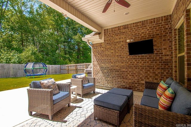 1449 Woolridge Dr, Benton, AR 72019 - view of patio / terrace with a trampoline, a ceiling fan, and an outdoor living space