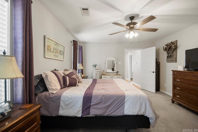 1449 Woolridge Dr, Benton, AR 72019 - bedroom with light colored carpet, ceiling fan, and baseboards