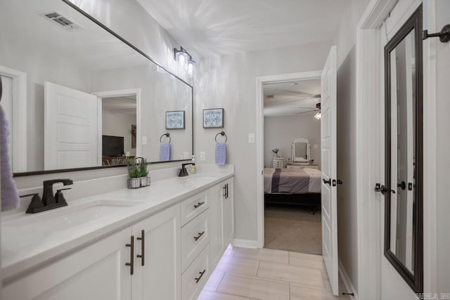 1449 Woolridge Dr, Benton, AR 72019 - bathroom featuring connected bathroom, double vanity, a ceiling fan, and baseboards