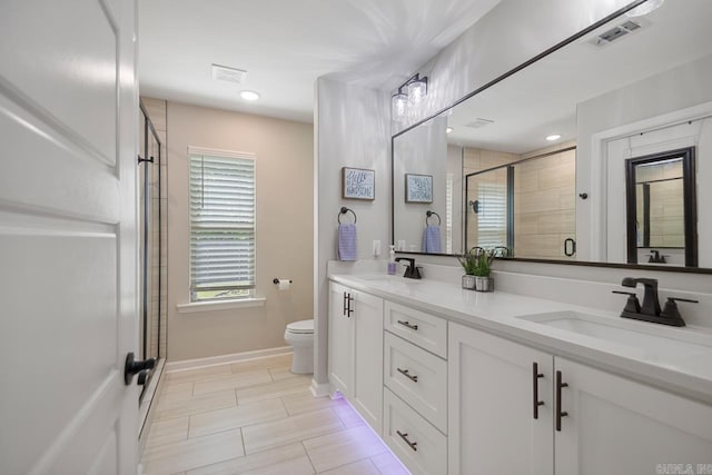 1449 Woolridge Dr, Benton, AR 72019 - full bath with toilet, double vanity, a stall shower, and baseboards