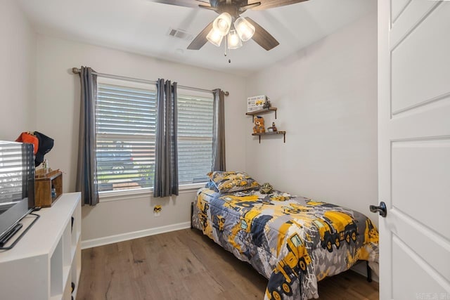 1449 Woolridge Dr, Benton, AR 72019 - bedroom with wood finished floors, baseboards, and a ceiling fan