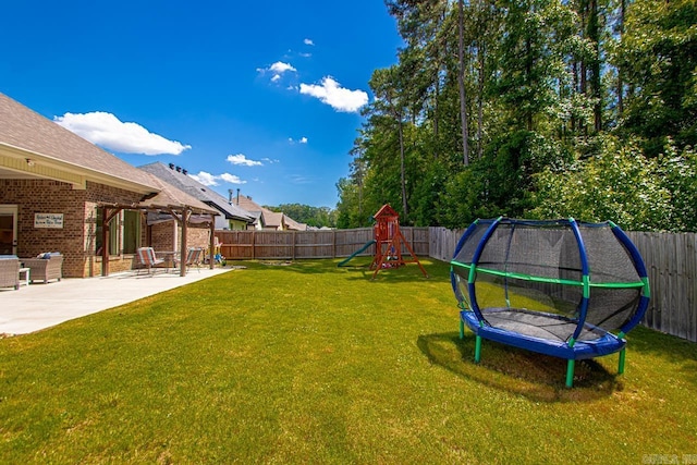 1449 Woolridge Dr, Benton, AR 72019 - view of yard with a trampoline, a playground, and a patio area