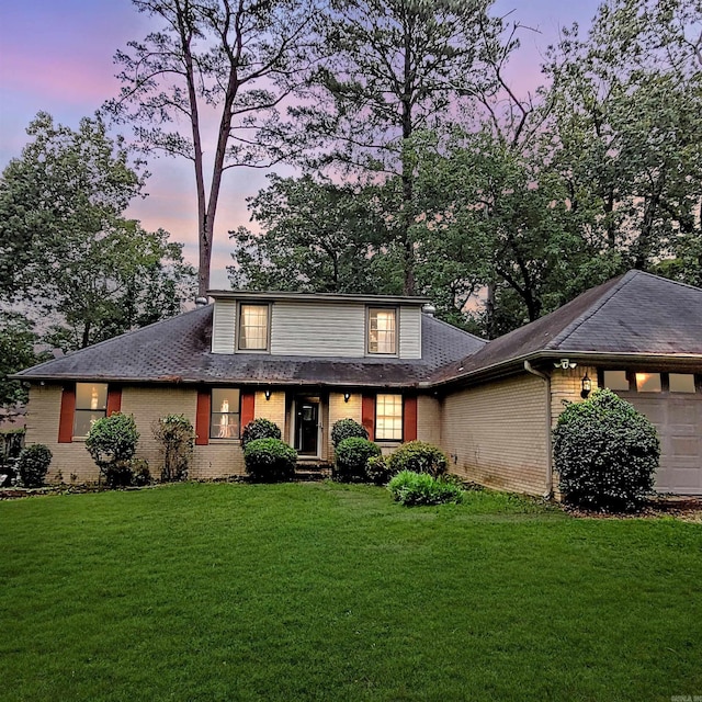 9 Apple Tree Cir, Little Rock, AR 72210 - traditional-style home with brick siding, a front yard, and a garage