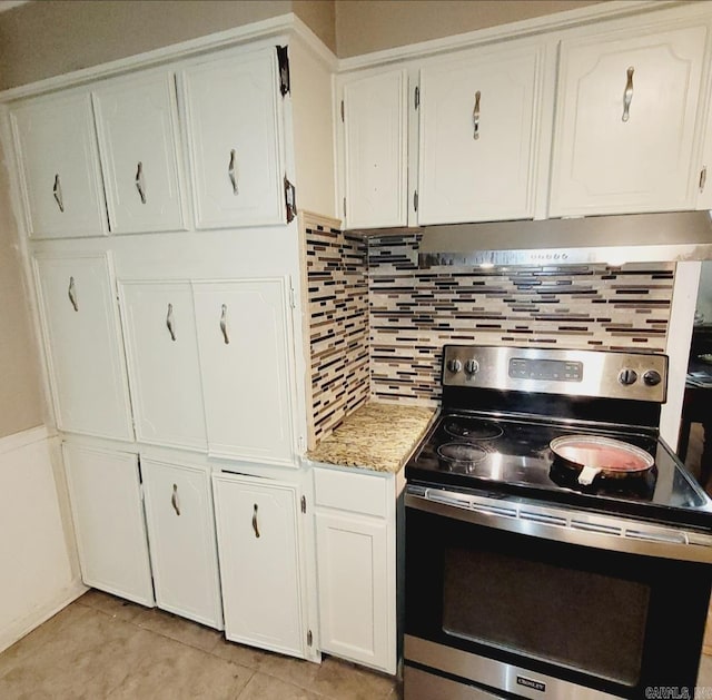 9 Apple Tree Cir, Little Rock, AR 72210 - kitchen featuring electric range, white cabinets, under cabinet range hood, and backsplash