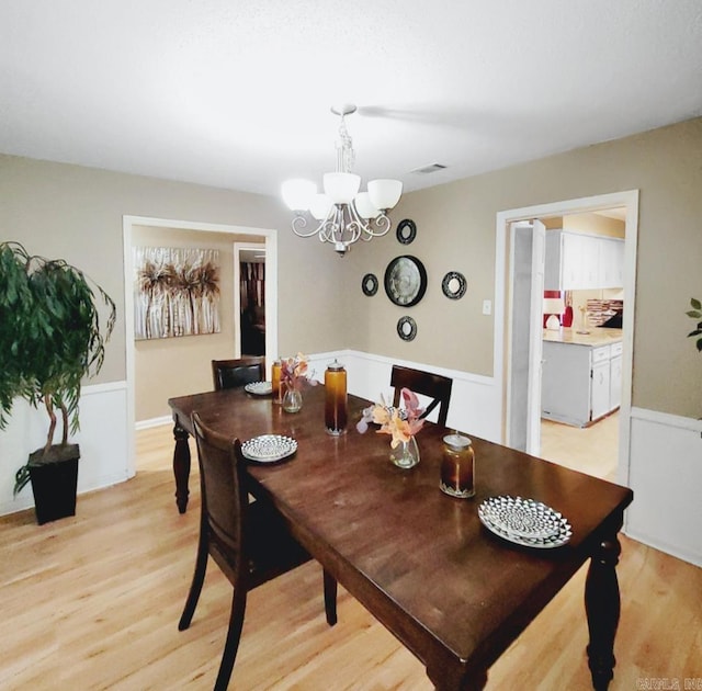 9 Apple Tree Cir, Little Rock, AR 72210 - dining room featuring a chandelier and light wood-style flooring