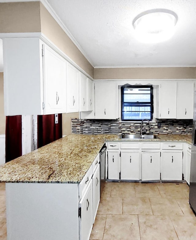 9 Apple Tree Cir, Little Rock, AR 72210 - kitchen with a sink, white cabinets, tasteful backsplash, light tile patterned floors, and light stone countertops