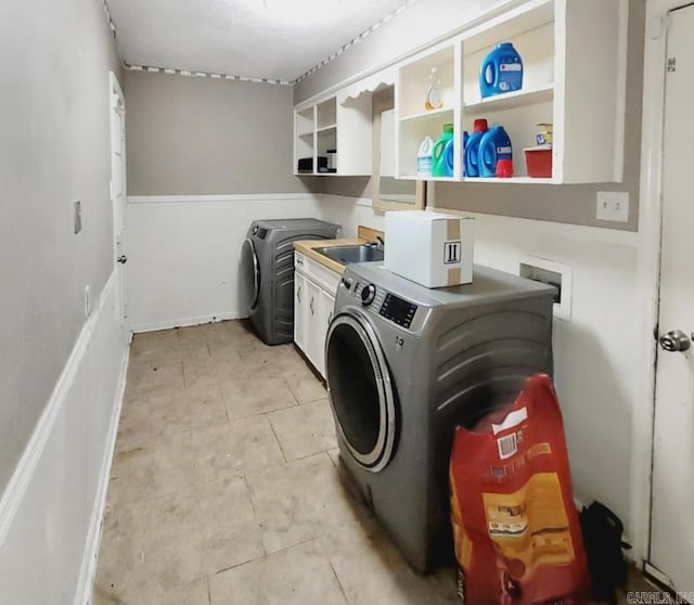 9 Apple Tree Cir, Little Rock, AR 72210 - washroom featuring cabinet space, washing machine and clothes dryer, and light tile patterned floors
