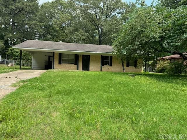 21304 N Mill Rd, Little Rock, AR 72206 - ranch-style home with driveway, an attached carport, and a front yard
