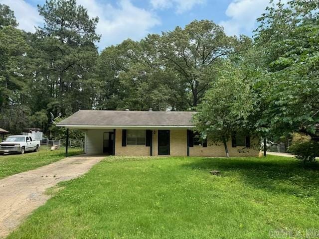 21304 N Mill Rd, Little Rock, AR 72206 - single story home with driveway, a carport, and a front lawn