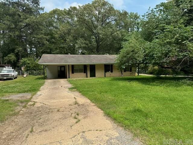 21304 N Mill Rd, Little Rock, AR 72206 - ranch-style house with driveway, a front yard, and a carport
