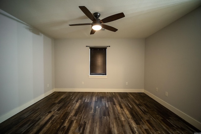 2330 Tyler St, Conway, AR 72034 - empty room featuring dark wood-style flooring, ceiling fan, and baseboards
