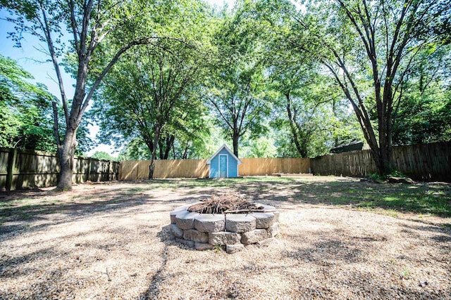 2330 Tyler St, Conway, AR 72034 - fenced backyard with a fire pit